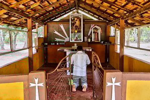 Tamil Catholic devotee offers prayers at a small church in Mannar, Sri Lanka. (This featured image was added online in 2024, and did not appear in the original print publication.)