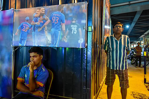 Fans watch the ICC World Cup 2023 final on a giant screen in the streets of Kolkata. (This featured image was added online in 2024, and did not appear in the original print publication.)