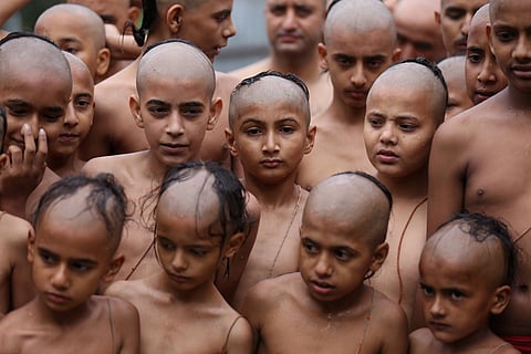 Novice priests at an ashram in Kathmandu. (This featured image was added online in 2024, and did not appear in the original print publication.)