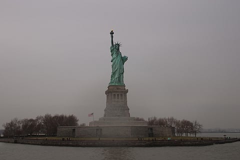 The Statue of Liberty on a dark, cloudy day