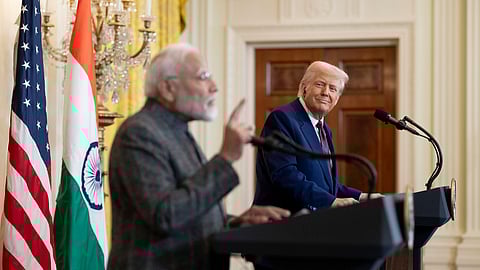 US president Donald Trump smiles as he watches India prime minister Narendra Modi taking questions during a joint press conference at the White House