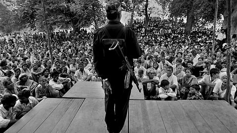 A member of the Naxalite movement making a speech to a group of supporters.