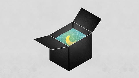 A glowing moon in a black box full of water