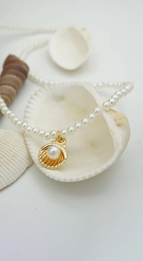 How do oysters form pearls?