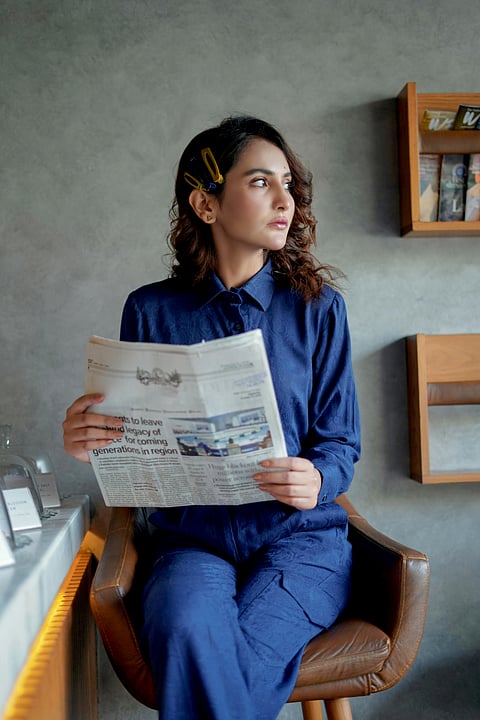 Why do they put colored dots under newspapers?