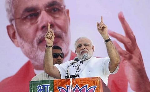 ஹர ஹர மோடி கோஷம்: மோடி, அமித் ஷா மீது வழக்கு பதிவு