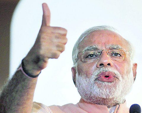 மோடி அலை: குஜராத் நிறுவன பங்குகள் விலை உயர்வு