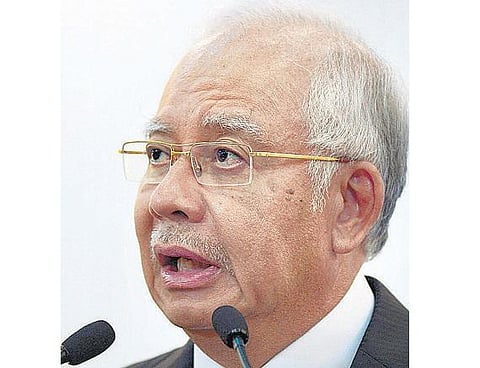 ரூ.4,500 கோடி முறைகேடு புகார்: மலேசிய பிரதமர் மீது எதிர்க்கட்சி வழக்கு- மறு தேர்தல் நடத்த வலியுறுத்தல்