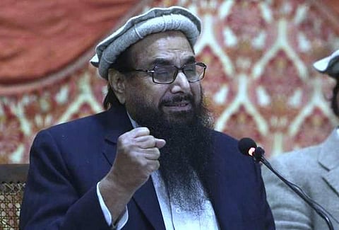 சர்வதேச நெருக்கடி: ஹபீஸ் சயித் உள்பட 3 பேர் மீது 23 வழக்குகள் பதிவு; பாக். அரசு கடும் நடவடிக்கை