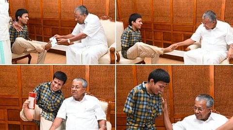 பேரிடர் நிவாரணத் தொகையை காலால் வழங்கிய மாற்றுத்திறனாளி: இன்முகத்துடன் ஏற்று செல்ஃபி எடுத்துக்கொண்ட பினராயி