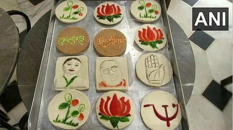 அரசியல் கட்சிகள் சின்னங்கள், தலைவர்கள்உருவம் வரையப்பட்ட இனிப்புகள் : படம் ஏஎன்ஐ