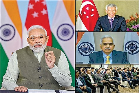 யுபிஐ – பேநவ் இணைப்பு நிகழ்வில் பங்கேற்ற பிரதமர் மோடி, சிங்கப்பூர் பிரதமர் லீ சியன் லூங், ரிசர்வ் வங்கி கவர்னர் சக்திகாந்த தாஸ் உள்ளிட்டோர். படம்: பிடிஐ