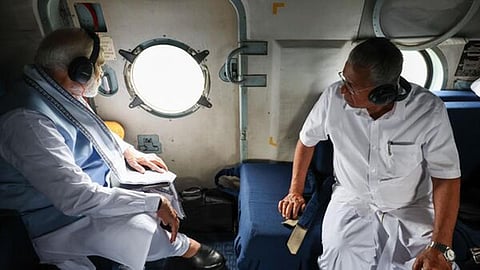 வயநாட்டில் நிலச்சரிவால் பாதிக்கப்பட்ட பகுதிகளை பிரதமர் மோடி நேற்று ஹெலிகாப்டரில் சென்று ஆய்வு செய்தார். உடன் கேரள முதல்வர் பினராயி விஜயன்.