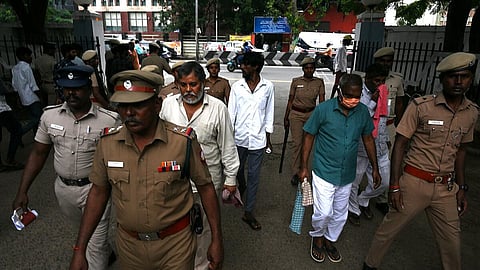 Members of Bawaria gang being escorted by police