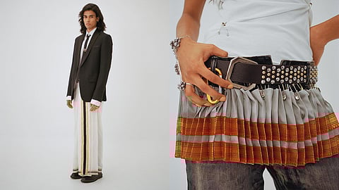 Photo of a man wearing a suit jacket, tie and a kasavu veshti with doc martens, and a skirt made from Bharatanatyam costume pleats styled over denim, styled by divya balakrishnan and photographed by sahil behal