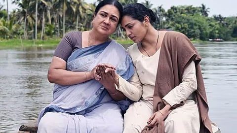 A screenshot from the trailer for Ullozhukk, a malayalam movie starring Urvashi and Parvathy Thiruvoth