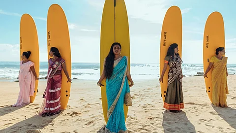 Shamali Sanjaya (centre) with members of the Arugam Bay Girls Surf Club.