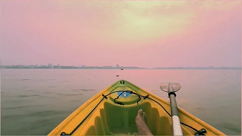 A Kayaker enjoys a day out at sea.