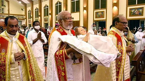 A Syro-Malabar congregation performing the warming ceremony with a procession unique to the community.