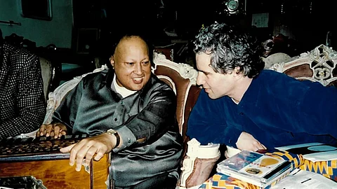 Nusrat Fateh Ali Khan with producer Michael Brook at Khan’s home in Lahore, Pakistan, in 1996