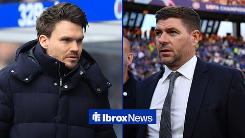 Danny Rohl standing in the dugout at Ibrox, with Steven Gerrard next to him wearing a suit.