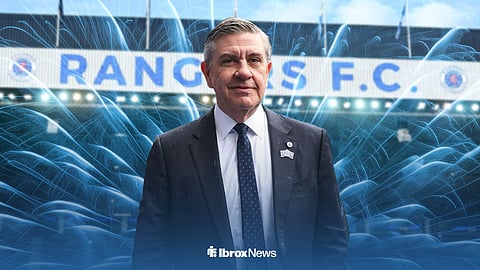 Andrew Cavenagh pictured in front of Ibrox, with fireworks going off arond him