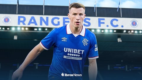 Lewis Ferguson in action in Rangers home kit ahead of Ibrox Stadium