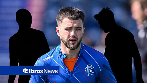 Nicolas Raskin in pre-match for Rangers, two mystery players behind him.