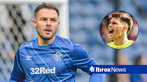 Jack Butland in a Rangers training top while warming up, with Hull City's Ivor Pandur shouting while in action.