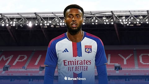 Youssef Chermiti in an Olympique Lyon shirt