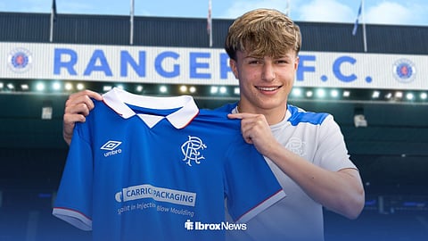 Max Cameron holding a Rangers shirt