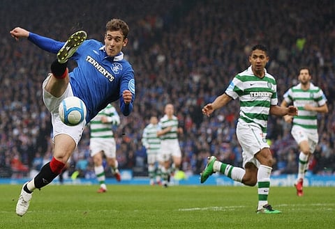 GLASGOW, SCOTLAND - MARCH 20: Emilio Izaguirre of Celtic tackles Nikica Jelavic of Rangers during the Co-operative Insurance Cup Final between Celtic and Rangers at Hampden Park on March 20, 2011 in Glasgow, Scotland.o. (Photo by Jeff J Mitchell/Getty Images)