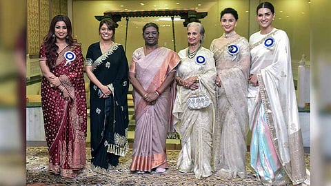 Indian President Droupadi Murmu with National film awardees Waheeda Rehman, Alia Bhatt, Kriti Sanon, Pallavi Joshi and Shreya Ghoshal during the 69th National Film Awards at Vigyan Bhawan in New Delhi. (ANI)