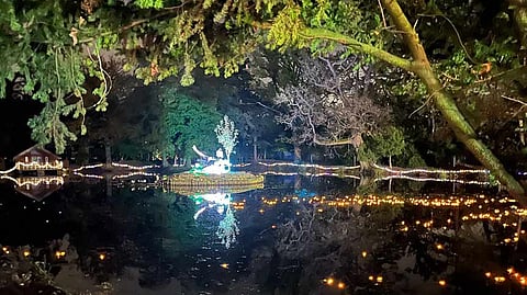 Pilgrims float diyas towards new statue at Bhaktivedanta Manor for Diwali