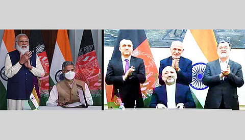 Prime Minister Narendra Modi with External Affairs Minister Dr S Jaishankar during the signing of an MoU between India and Afghanistan, on the construction of Shahtoot dam near Kabul, through video conferencing with Afghanistan President Ashraf Ghani.