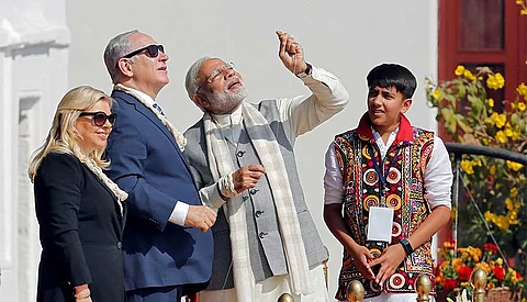 Indian prime minister Narendra Modi flies a kite watched by his Israeli counterpart Benjamin Netanyahu and his wife Sara. India, Israel and the UAE are poised to reap the benefits of a unique tri-lateral partnership following the restoration of diplomatic ties between Tel Aviv and Abu Dhabi.
