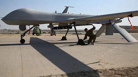 A pilot conducts a pre-flight check of a US Air Force MQ-1B Predator unmanned aerial vehicle (UAV), at a secret air base in the Persian Gulf region. India and the US currently enjoying very rewarding ties in defence, and many believe that the best is yet to come.