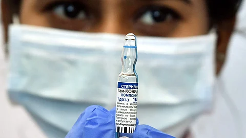 A health worker poses for a photograph with Sputnik V vaccine during a pilot vaccination program at Apollo Hospitals in Hyderabad. India’s request for a vaccine patent waiver to help in speedy manufacturing may not be met due to objections by other nations.