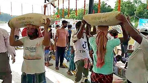 Workers unloading cement from vessels from Bangladesh. India and Bangladesh are enjoying a newfound surge in trade and exports. The latter has become an able trade partner as exports to many of India’s traditional markets shrank because of the pandemic.