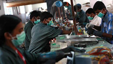 Time to reenergise investments. Workers dismantle old computers and electronics at an electronic waste recycling factory in Bengaluru, India. The rising flow of funds is buoying up valuations in the Indian start-up universe. This year, an estimated 25 start-ups attained unicorn status (valuation of $1 billion) compared to 12 such cases last year.