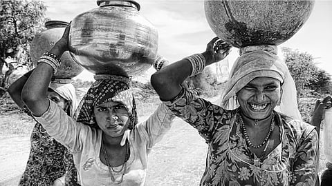 Women in India still bear the burden of fetching water from long distances