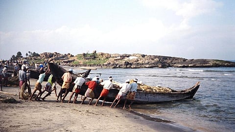 Fishermen venturing out into the sea in Vizhinjham in Kerala