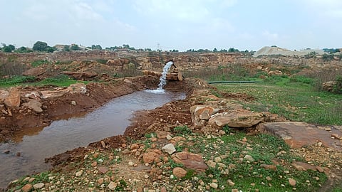 Groundwater gushing out of blasted aquifers in a quarry in Madihan tehsil is pumped away as waste — a routine practice across local mines.