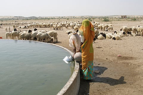 Women draw water from a well in Thar desert, Rajasthan