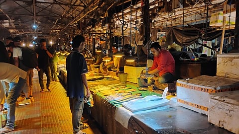 The famous Lake Chowmani fish market in Agartala city, where Hilsa is placed on an ice tray and displayed on the right under a special light.
