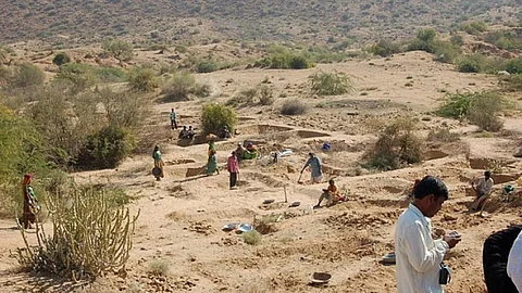 Constructing check dams under MGNREGA. (Source: IWP Flickr Photos)