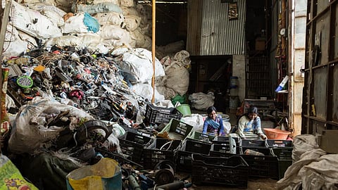 Waste pickers and sorters working hard to extract recyclable value from the waste we throw out (Image: Vinod Sebastian/ Saamuhika Shakti)