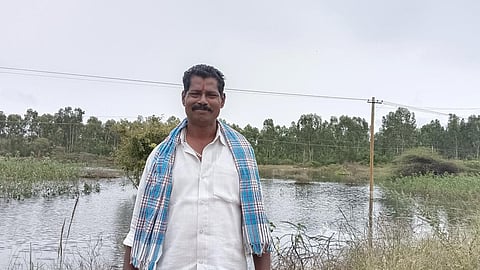 Narasimhappa, a village resident, positioned against the backdrop of the Agrahara tank (Image: FES)