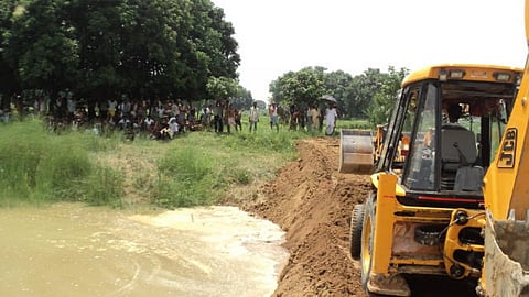 Earthmovers carrying out irrigation project works