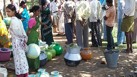 Queuing up for water (Source: IWP Flickr Photos)